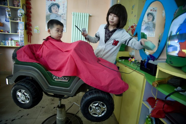 epa03117576 A Chinese child gets hair cut for good luck on Dragon Head-Raising Day in a barbershop of Qingdao city, eastern China's Shandong province, 23 February 2012. Chinese Dragon Head-Raising Day, or called Spring Dragon Day is a traditional Chinese festival that falls on the second day of the second lunar month, whereby people gather to get a hair cut for good luck for the whole year. EPA/WU HONG