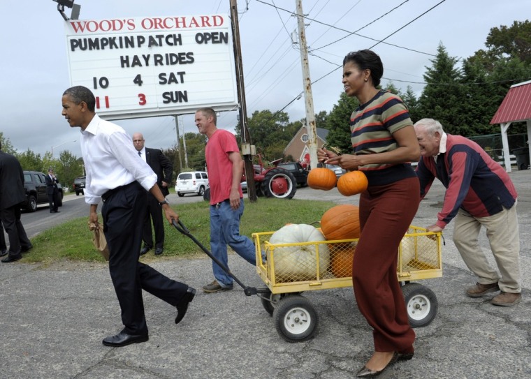 President Barack Obama and first lady Michelle Obama stop to buy pumpkins at Wood's Orchard in Hampton, Va, Wednesday, Oct. 19, 2011. Obama is on a three-day bus tour promoting the American Jobs Act. (AP Photo/Susan Walsh)
