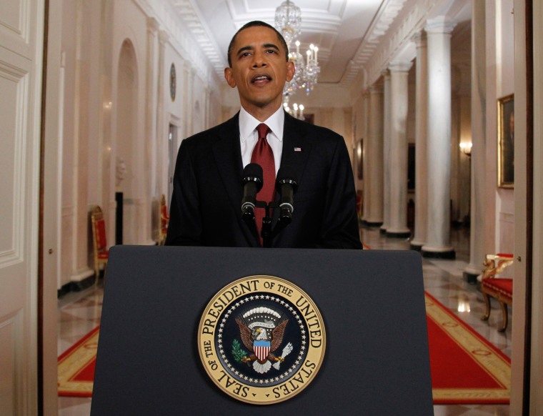 President Barack Obama reenacts his speech for still photographers after announcing on live television the death of Osama bin Laden.