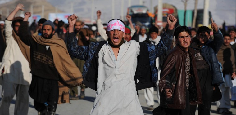 Afghan demonstrators shout anti-US slogans during a protest against Koran desecration in Kabul on February 24, 2012. Four people were killed on February 24 when anti-US protests turned violent in the western province of Herat, bringing the overall death toll during four days of demonstrations to at least 19, officials said. Two died as demonstrators surged towards the US consulate in Herat city while two more were killed in Adraskan district, provincial spokesman Moheedin Noori told AFP. AFP PHOTO/SHAH Marai (Photo credit should read SHAH MARAI/AFP/Getty Images)