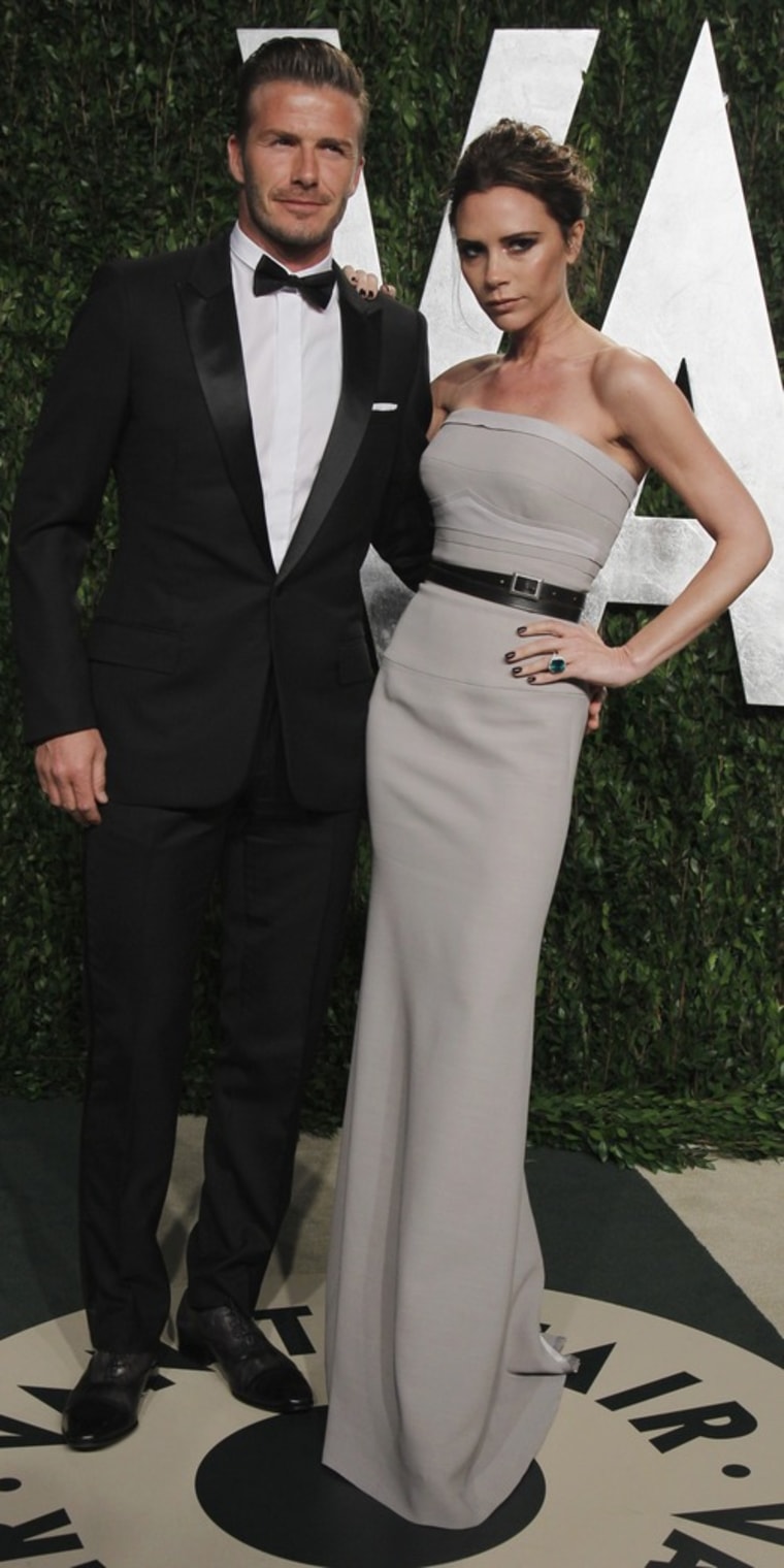 Footballer David Beckham and wife and singer Victoria Beckham arrive at the 2012 Vanity Fair Oscar party in West Hollywood, California February 26, 2012. REUTERS/Danny Moloshok (UNITED STATES - Tags: ENTERTAINMENT SPORT) (OSCARS-PARTIES)