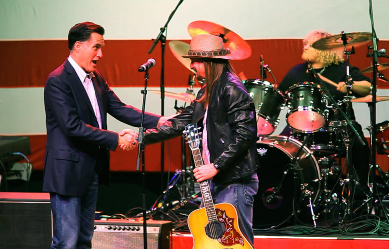 Monday, February 27, 2012, in Royal Oak, MI (John Makely / msnbc.com) Mitt Romney thanks Kid Rock he and his band performed at the rally supporting Romney's campaign for President. The marquis sign of the Royal Oak theater in Royal Oak, Michigan announces the invitation only rally for Mitt Romney on the eve of the Republican primary election in his home state of Michigan.