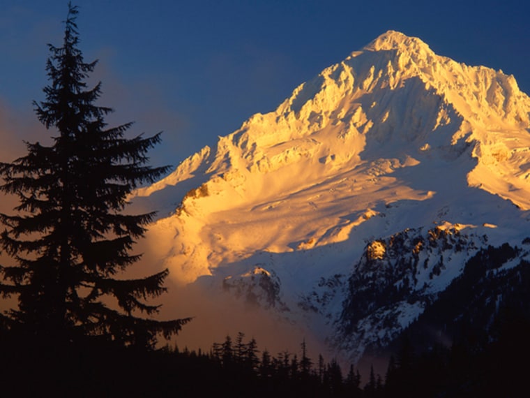 12 Dec 1996, Oregon, USA --- Alpenglow on a Snow Covered Mountain --- Image by © Steve Terrill/Corbis