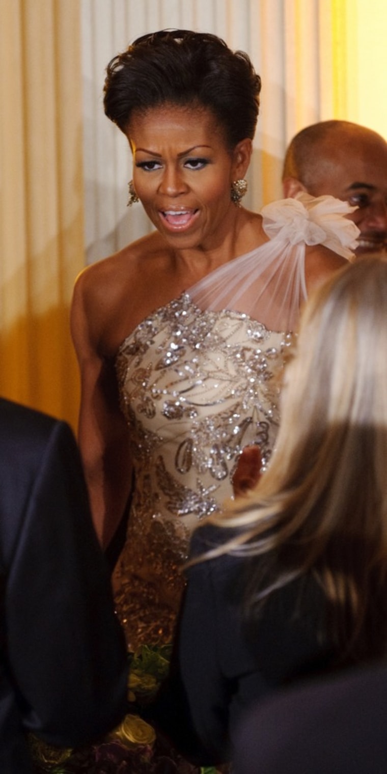 US First Lady Michelle Obama arrives for the 2012 Governorsâ€™ Dinner on February 26, 2012 in the State Dining Room of the White House in Washington. AFP PHOTO/Mandel NGAN (Photo credit should read MANDEL NGAN/AFP/Getty Images)
