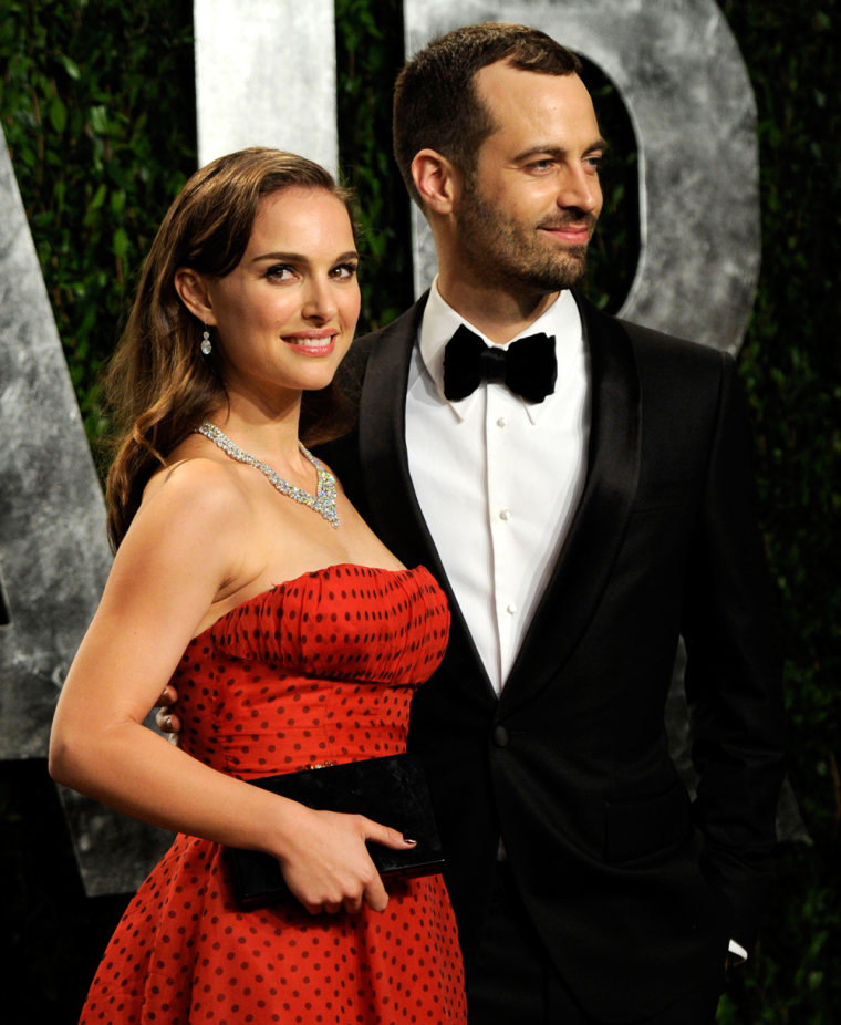 Natalie Portman, left and Benjamin Millepied arrive at the Vanity Fair Oscar party on Sunday, Feb. 26, 2012, in West Hollywood, Calif. (AP Photo/Evan Agostini)
