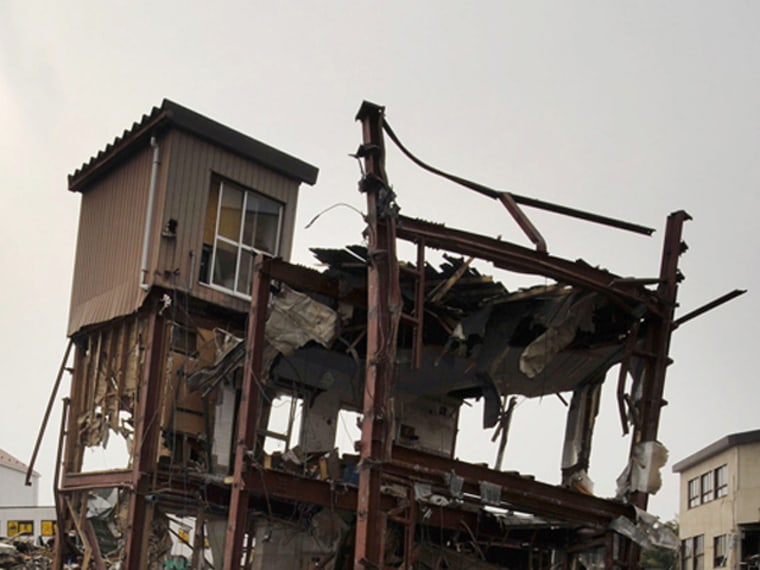 In this combo of two photos, a damaged house stands in a flooded residential area March 20, 2011, left, and the sun shines over the same area June 3, 2011 in Kesennuma, Miyagi Prefecture, northeastern Japan. Japan marks three month since the March 11 earthquake and tsunami Saturday, June 11, 2011. (AP Photo/Kyodo News) JAPAN OUT, MANDATORY CREDIT, NO LICENSING IN CHINA, HONG KONG, JAPAN, SOUTH KOREA AND FRANCE