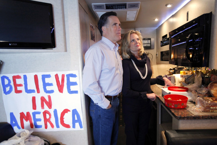 Republican presidential candidate and former Massachusetts Governor Mitt Romney (L) and his wife Ann prepare to leave their campaign bus for a campaign stop at Music Man Square in Mason City, Iowa December 29, 2011, ahead of the Iowa Caucus on January 3, 2012. REUTERS/Brian Snyder (UNITED STATES - Tags: POLITICS)