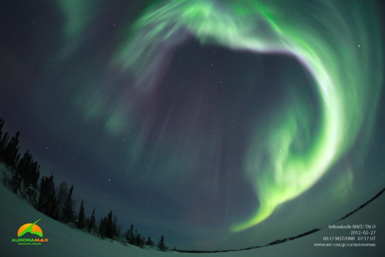 Northern lights shine through a crack