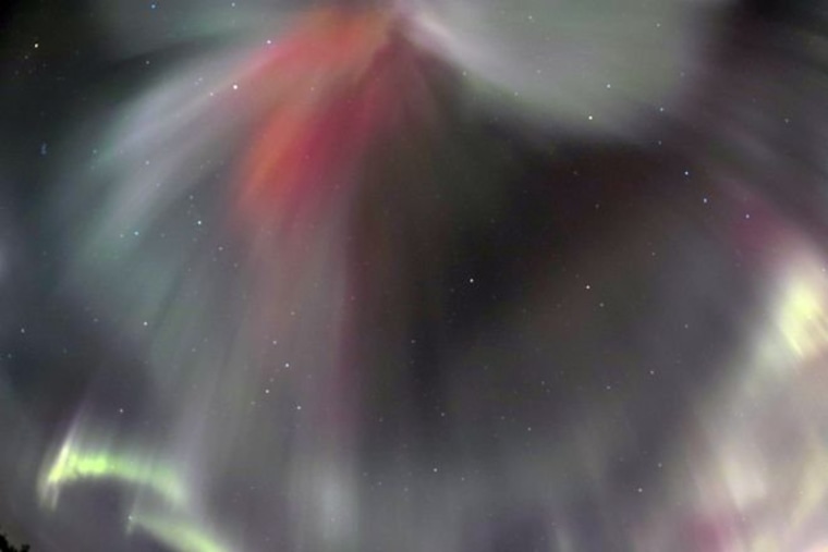 Northern lights shine through a crack