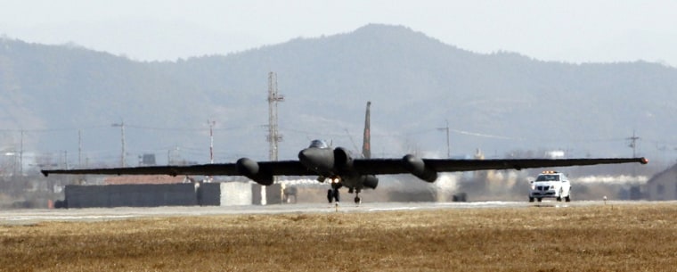 In this photo taken on Feb. 16, 2012, a U.S. Air Force U-2 spy plane takes off as a chase car stands by during a training flight at the U.S. airbase in Osan, south of Seoul, South Korea. For more than 35 years, the Cold War era aircraft has been one of Washington's only reliable windows into military movements inside North Korea. As the world watches for signs of instability during North Korea's transition to a new leadership, the U-2 operations are as important _ or more so _ than ever. (AP Photo/Lee Jin-man)