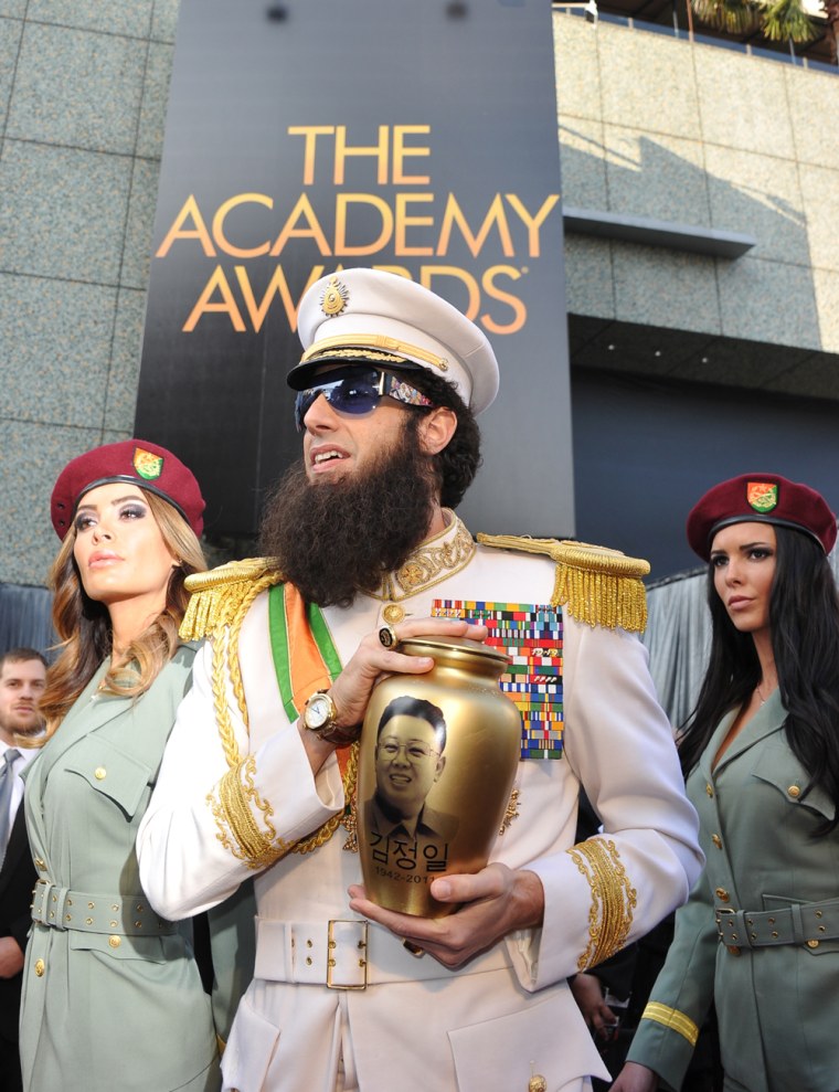 Actor Sacha Baron Cohen dressed as his role of the Dictator arrives on the red carpet for the 84th Annual Academy Awards on February 26, 2012 in Hollywood, California. AFP PHOTO Joe KLAMAR (Photo credit should read JOE KLAMAR/AFP/Getty Images)