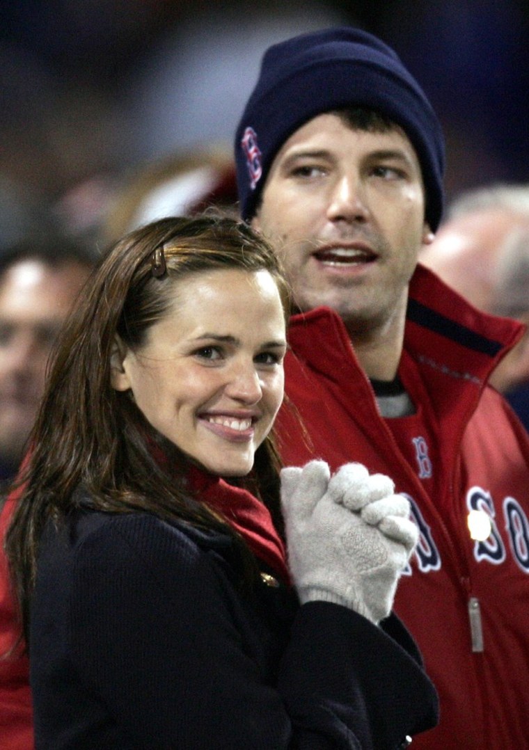 Actors Jennifer Garner (L) and Ben Affleck attend Game 1 of the World Series between the Red Sox and St. Louis Cardinals at Fenway Park in Boston, in this October 23, 2004 file photo. Garner and Affleck have welcomed their third child, a baby boy, People magazine said on February 28, 2012, without giving further details. Garner wed actor and producer Affleck in June 2005 at a private ceremony in the Caribbean. They welcomed their first daughter, Violet, in December 2005, and second daughter Seraphina in 2009. REUTERS/Mike Segar/Files (UNITED STATES - Tags: ENTERTAINMENT SPORT BASEBALL)