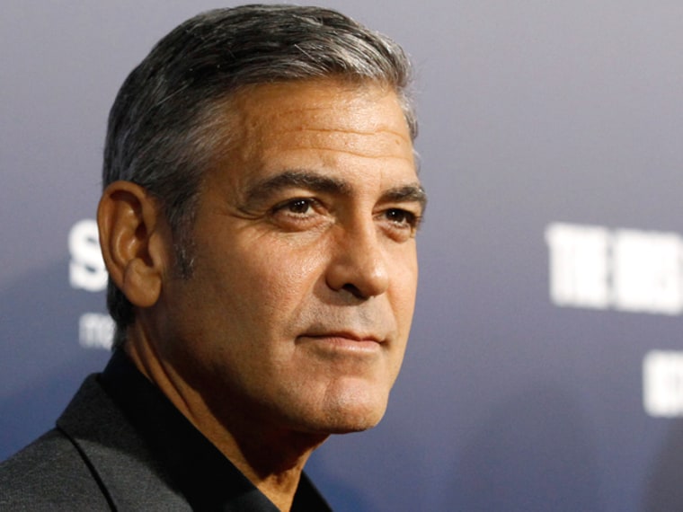 Director and cast member George Clooney poses at the premiere of