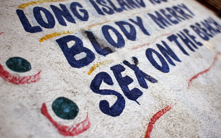 ACAPULCO, MEXICO - FEBRUARY 29: A bar advertisement beckons tourists on the beach on February 29, 2012 in Acapulco, Mexico. One of Mexico's top tourist destinations, Acapulco has suffered a drop in business, especially from foreign tourists, due to drug violence in the last year. Toursim accounts for some 9 percent of Mexico's economy and about 70 percent of the output of Acapulco's state of Guerrero. (Photo by John Moore/Getty Images)