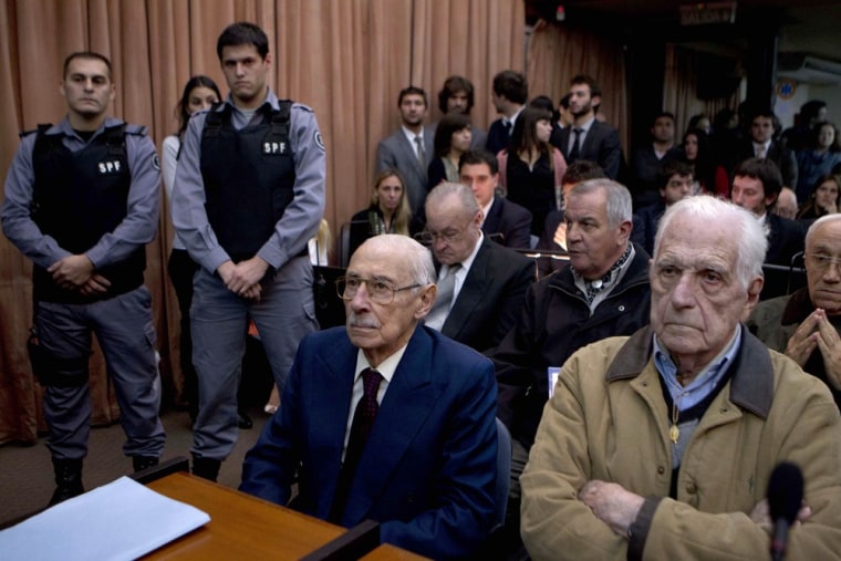 Former dictators Jorge Rafael Videla, second from right, and Reynaldo Bignone, right, wait to listen the verdict of Argentina's historic stolen babies trial in Buenos Aires, Argentina, on Thursday.
