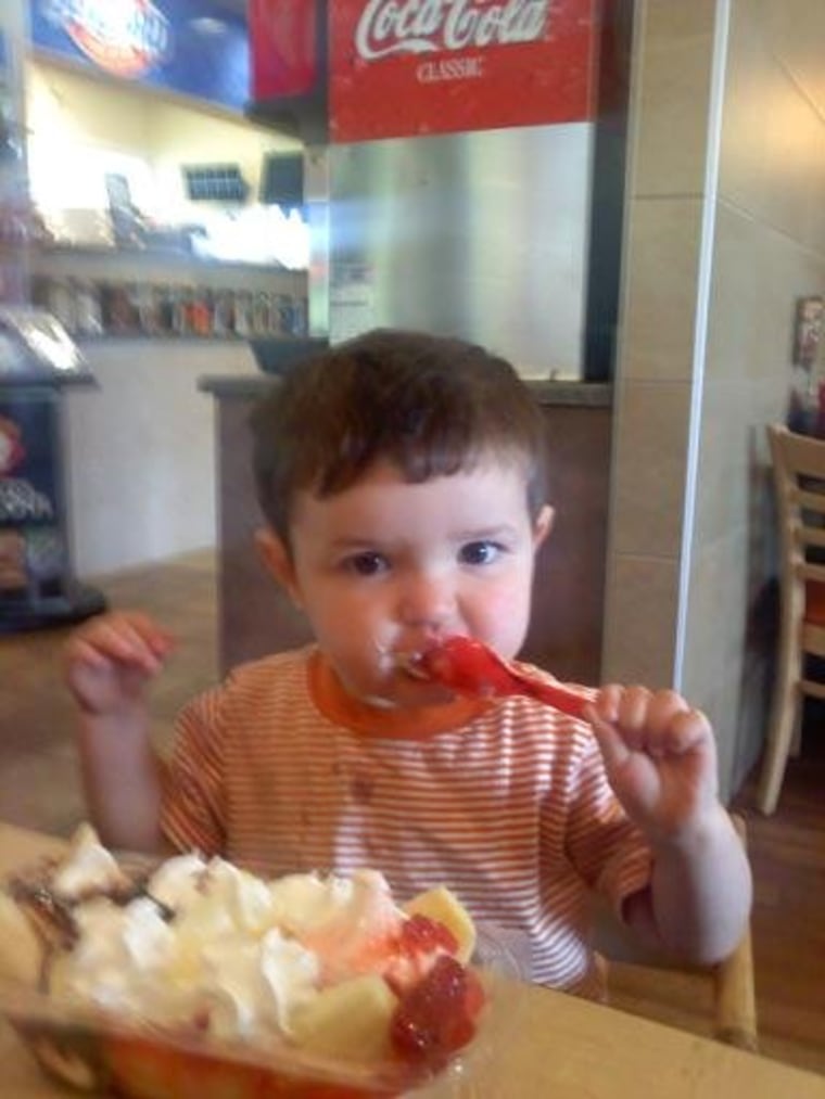 David, 22 months, samples his very first banana split...just for Ryan.