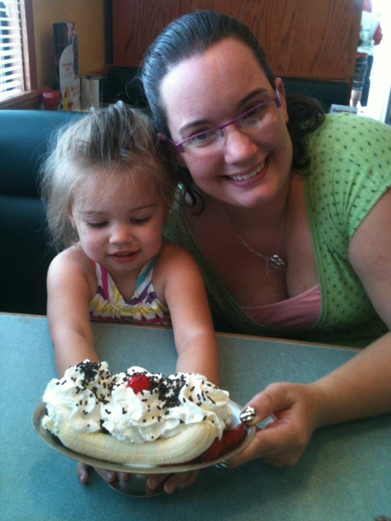 Casey, 3, and her mom pose with their split creation.