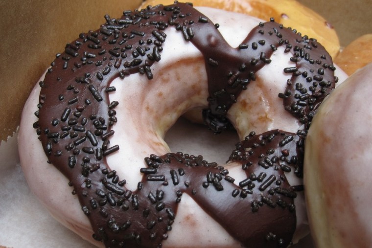The Doughnut Vault in Chicago sells doughnuts such as this old-fashioned  chocolate-glazed version and $1 cups of coffee.