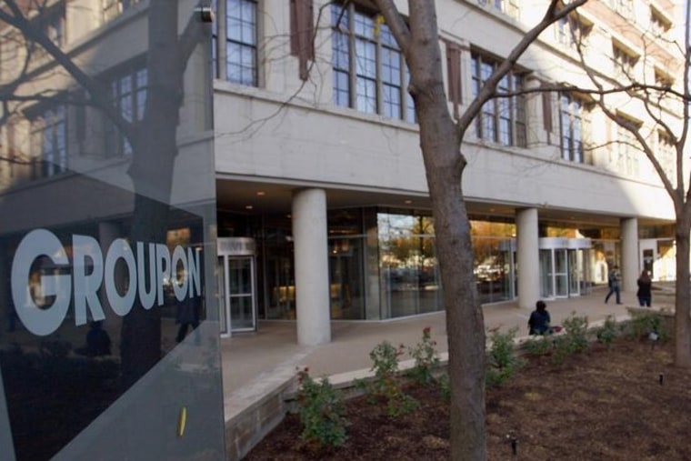 People enter and leave Groupon Inc corporate office and headquarters in Chicago, Illinois, November 4, 2011.