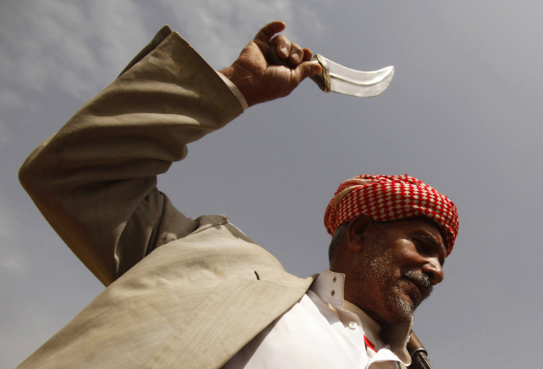 A tribesman performs the traditional Baraa dance in the northwestern province of Saada, Yemen on July 12, 2012.