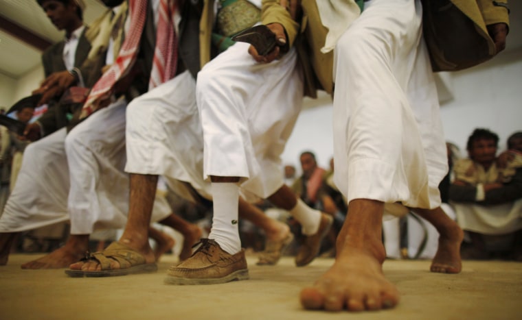 Tribesmen loyal to al-Houthi Shi'ite rebel group perform the traditional Baraa dance in the northwestern province of Saada, Yemen on July 11, 2012.