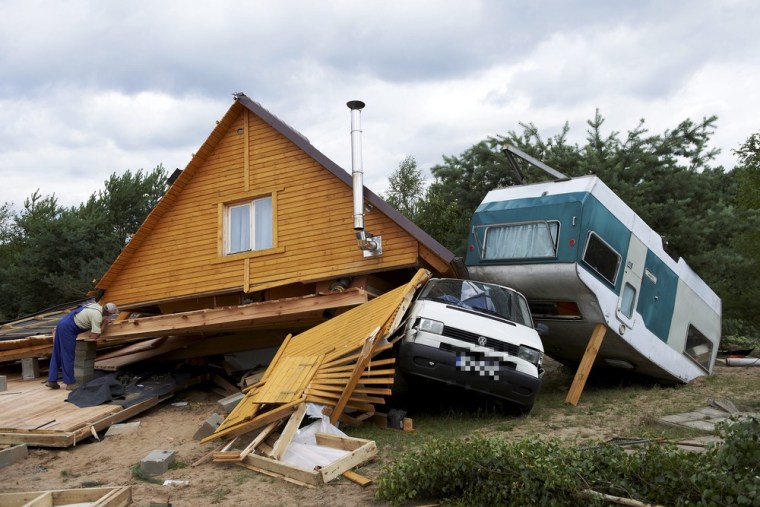 The remains of a damaged house after a tornado hit Wycinki village, Poland. The south-eastern part of Poland has been hit by a whirlwind on Saturday that tore off the roofs of buildings, destroyed power poles and a cottage (shows in the picture), killing a man inside and injuring four others.