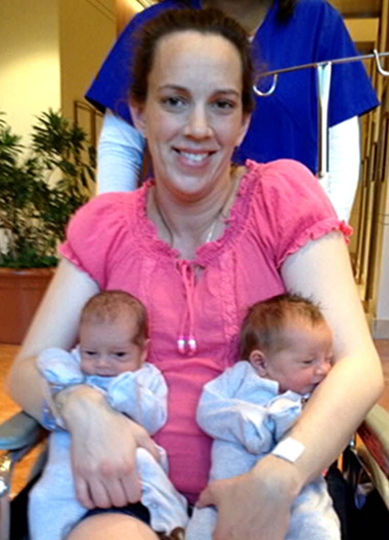 Lana Kuykendall holding her twins, born in early May.