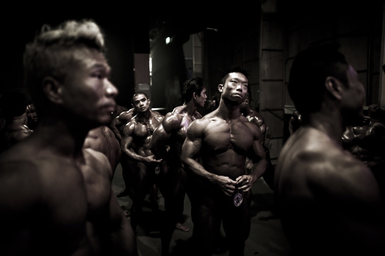 Competitors wait backstage during the 2012 International Bodybuilding and Fitness Invitation Championship in Hong Kong on July 15.