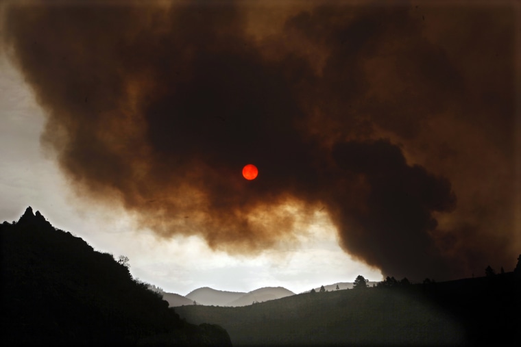 Tenerife forest fire darkens sky over island