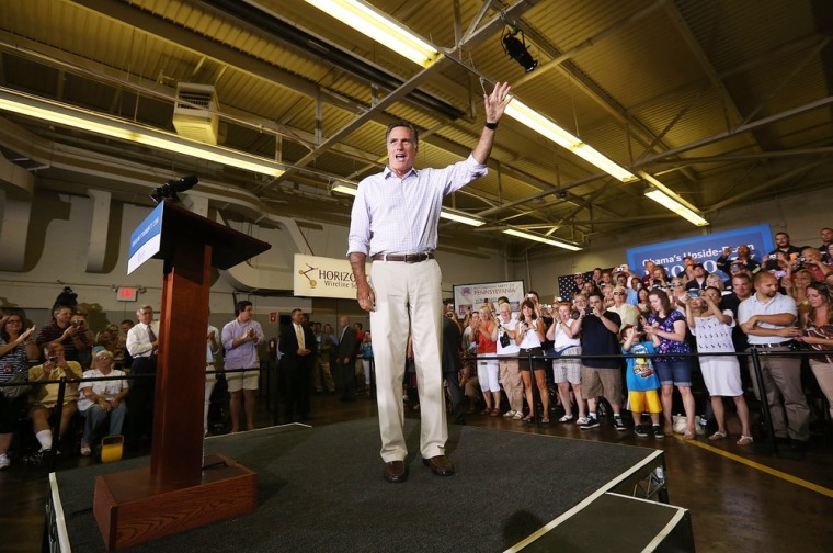 Republican presidential candidate Mitt Romney arrives on stage before speaking at a campaign rally at Horizontal Wireline Services July 17 in Irwin, Pa.