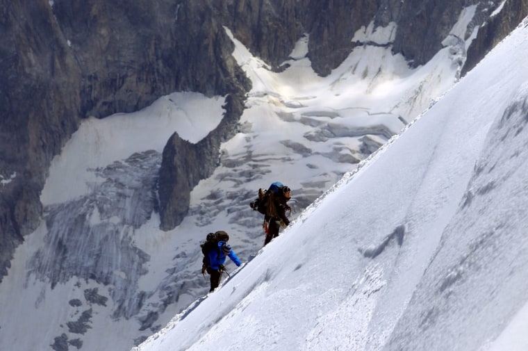 Climbers make their way Aiguille du Midi at 12,605 feet, a part of the Mont Blanc mountain near Chamonix ski resort, France, on July 17.