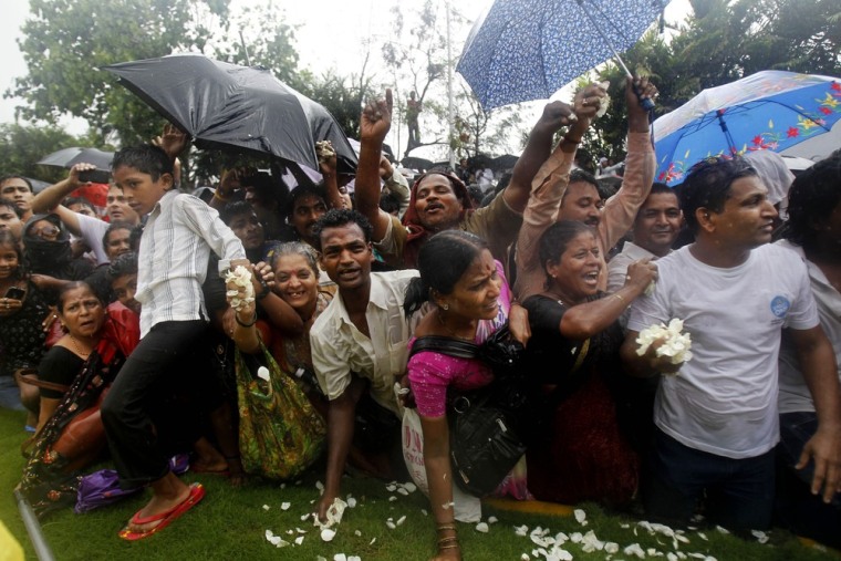 Fans react during the funeral of Rajesh Khanna in Mumbai on July 19, 2012.