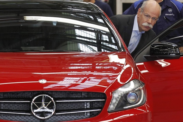 Daimler AG's Chief Executive Officer Dieter Zetsche enters a new Mercedes A-class car at the Mercedes plant in Rastatt, Germany.