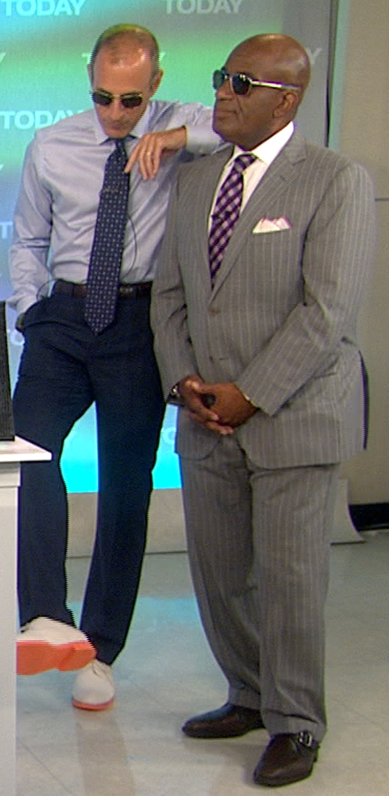 Clearly getting in on the hot trend, TODAY's Matt Lauer shows Al Roker the bright orange soles of his shoes.
