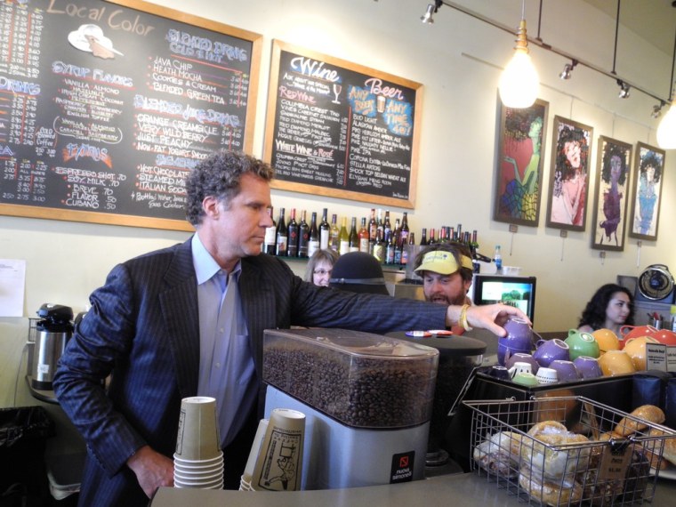 Will Ferrell randomly rearranges coffee cups as Zach Galifianakis talks to a barista at the Local Color coffeehouse in Seattle.