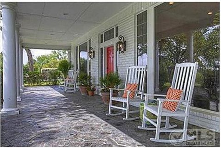 A large, wraparound front porch faces Clarkson's front lawn.