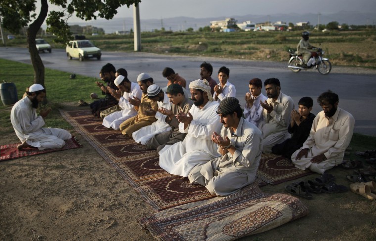 Pakistanis attend the daily Asr prayer, or afternoon prayer, in Islamabad on July 20.