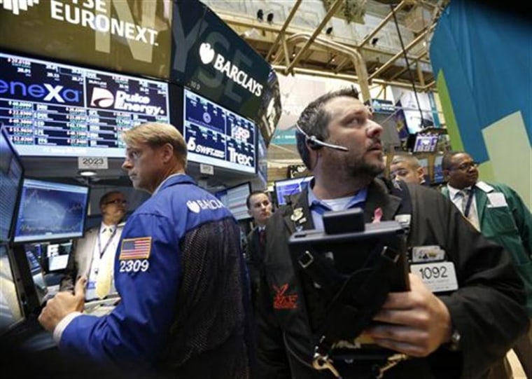 Traders work on the floor of the New York Stock Exchange.
