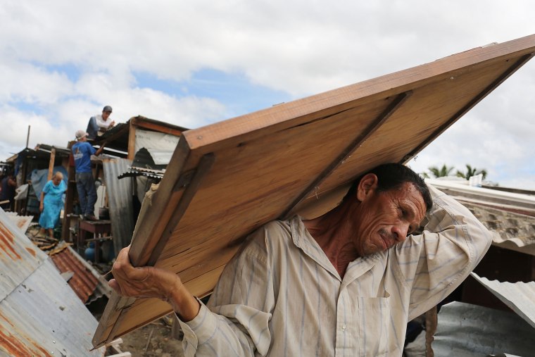 A man dismantles his shack during an eviction on July 20.