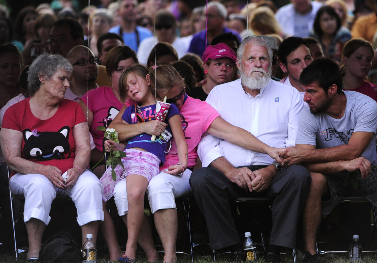 Family members of the victims of the Century 16 theater shooting remember their loved ones during a vigil at the Aurora Municipal Center campus in Aurora, Colo., July 22. Twelve people were killed and 58 were injured in a shooting during an early Friday premiere of