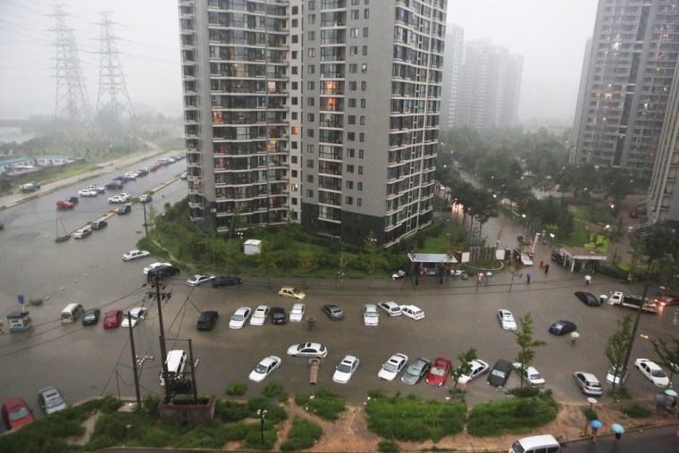 Cars submerged in floodwaters around a residential block after heavy rains in Beijing on July 21, 2012. Photo made available to NBCNews.com on July 23, 2012.
