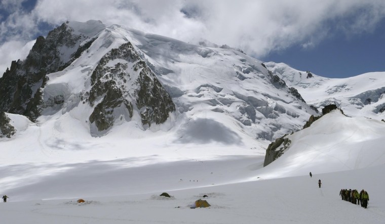 Mark Kelly, NASA astronaut and commander of mission STS-134, walks with NASA astronaut Greg Johnson, ESA astronaut Roberto Vittori and other roped party members walk from the Refuge des Cosmiques back to L'Aiguille du Midi near Mont-Blanc in Chamonix July 23.