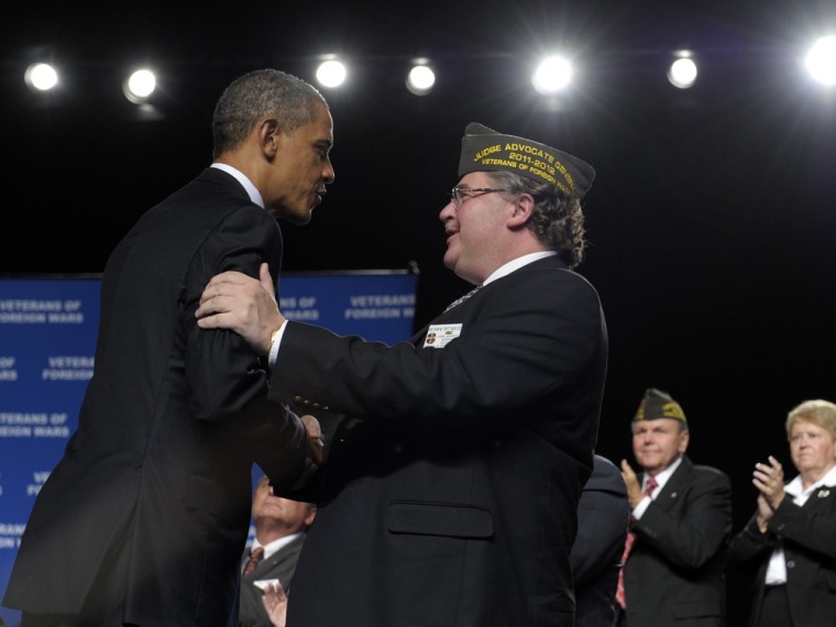 President Barack Obama greets VFW National Commander Richard L. DeNoyer after speaking at the 113th National Convention of the VFW July 23 in Reno, Nev.