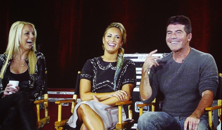 Britney Spears, Demi Lovato and Simon Cowell, judges on \"The X Factor.\"