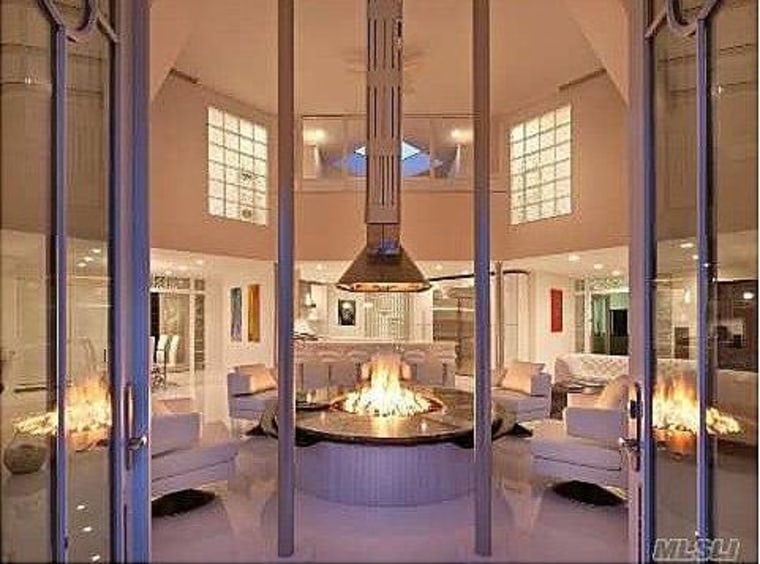 An open fire pit and seating area adjoins the kitchen.