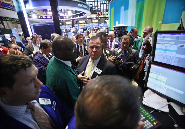 Traders work on the floor of the New York Stock Exchange Tuesday.