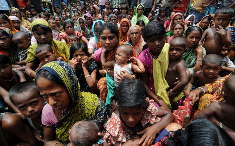 Indian displaced villagers wait at a relief camp at Bijni village in Chirang District on July 26, after a week of clashes that left at least 45 people dead.