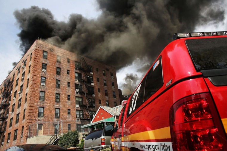 Firefighters battle a six-alarm fire in Brooklyn on Thursday.