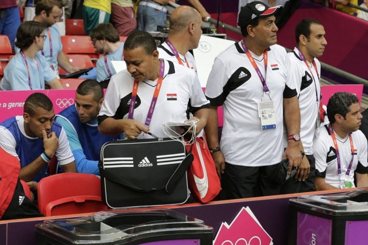 Members of Egypt's soccer team look for seats in early action at the Summer Olympics in London. Nike said it would donate authentic apparel to replace the knockoffs being worn by Egypt's Olympic team.