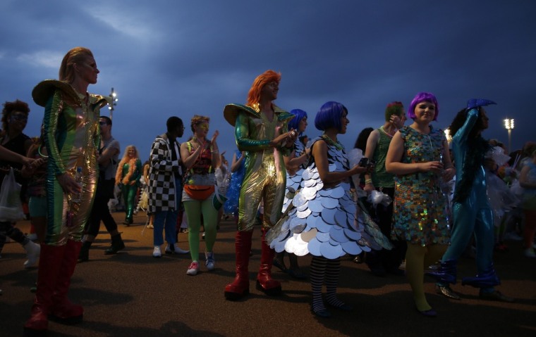 Performers are seen before the start of the opening ceremony of the London 2012 Olympic Games next to the Olympic Stadium, July 27.